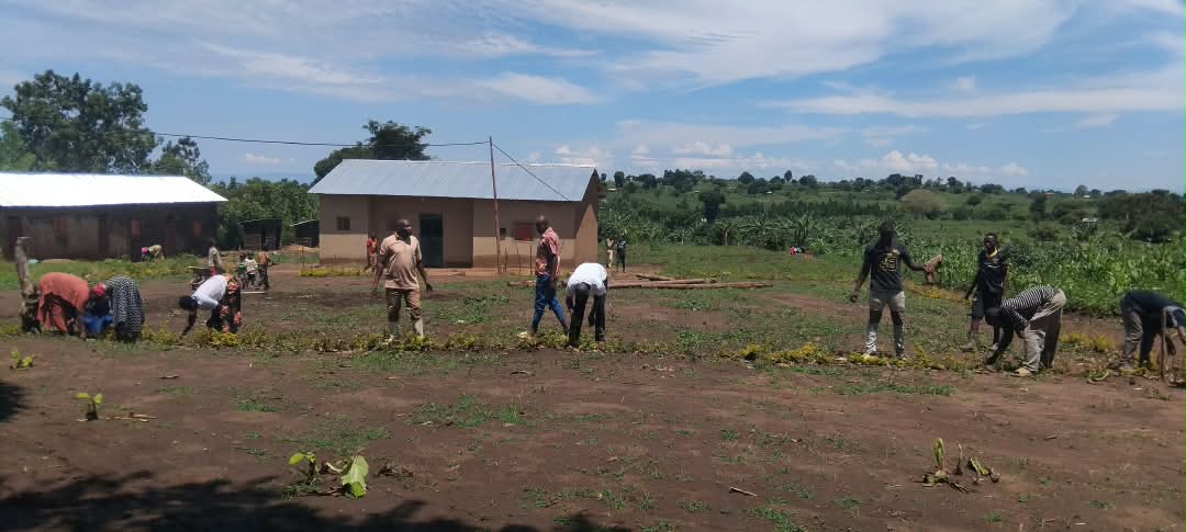 Community volunteers and youth working together on school grounds